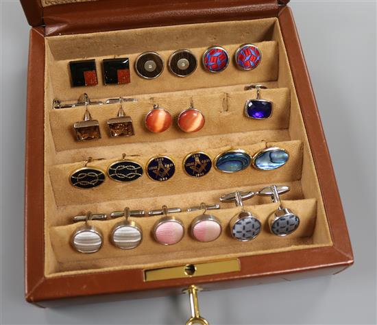 An Asprey & Garrard brown leather cufflink box containing 12 pairs of cufflinks, various.